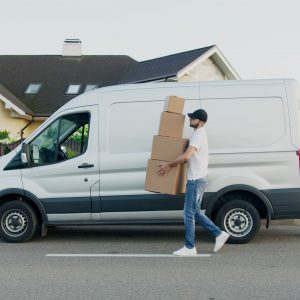 Man with boxes and van