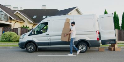 Man with boxes and van